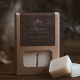 Antiquities wax melt cubes in kraft packaging with a dark brown label