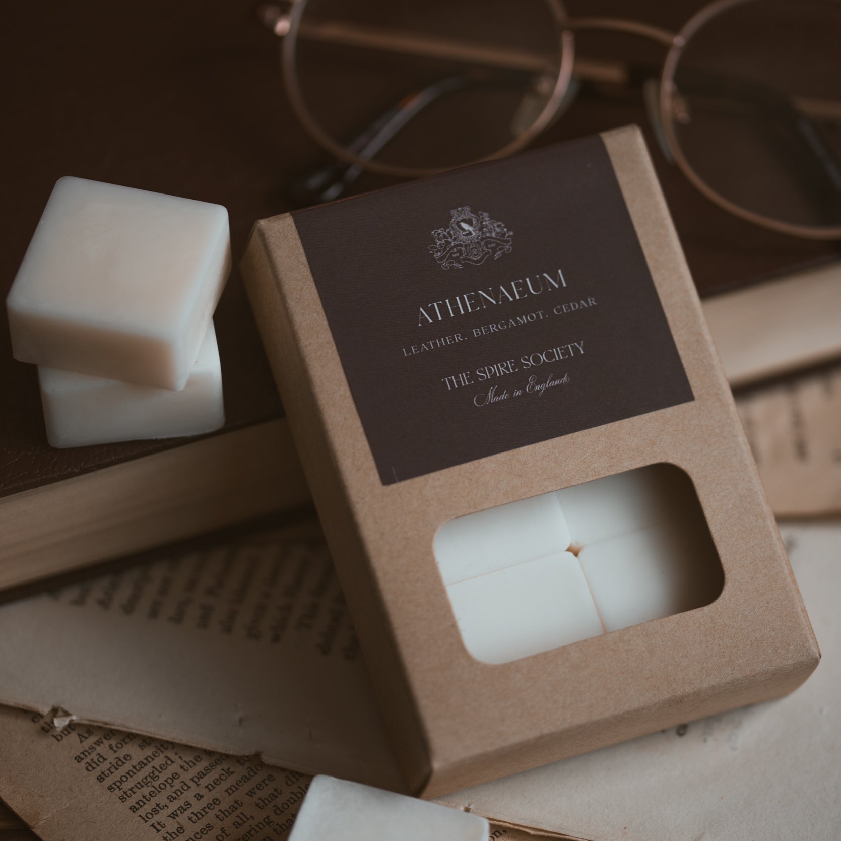 Athenaeum wax melt cubes in kraft packaging with dark brown label