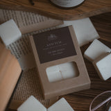 Sanctum wax melt cubes in kraft packaging with dark brown label